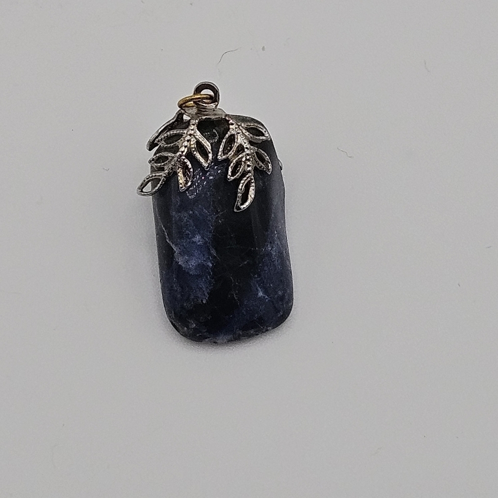 sodalite blue stone pendant with silver tone leafy bail